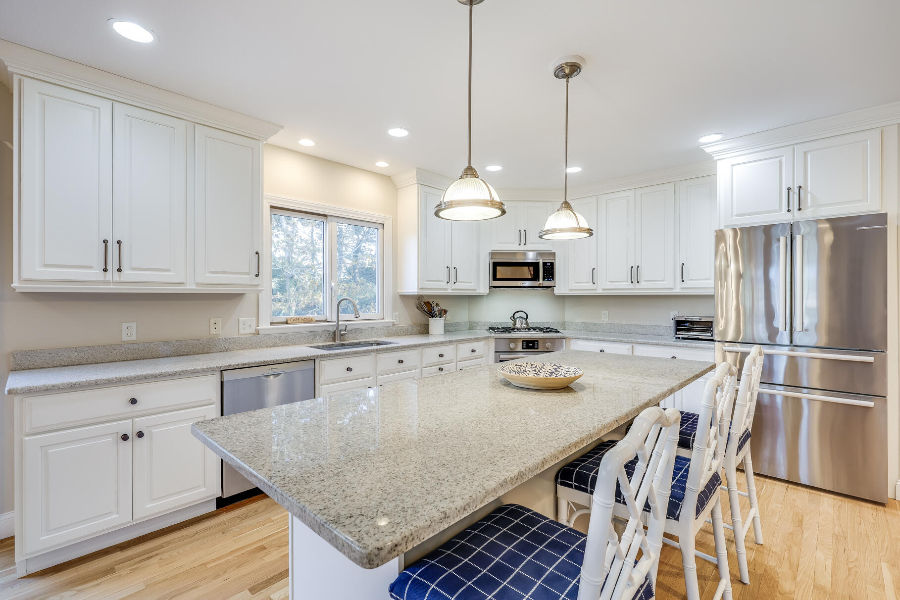 9 Ridgewood Road Orleans, MA 02653 - Photo 24 of 81 a kitchen with stainless steel appliances granite countertop a sink a stove a refrigerator and center island
