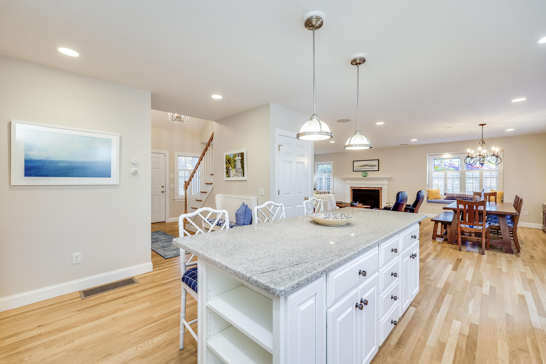 9 Ridgewood Road Orleans, MA 02653 - Photo 26 of 81 a view of a dining room and livingroom with furniture wooden floor a chandelier
