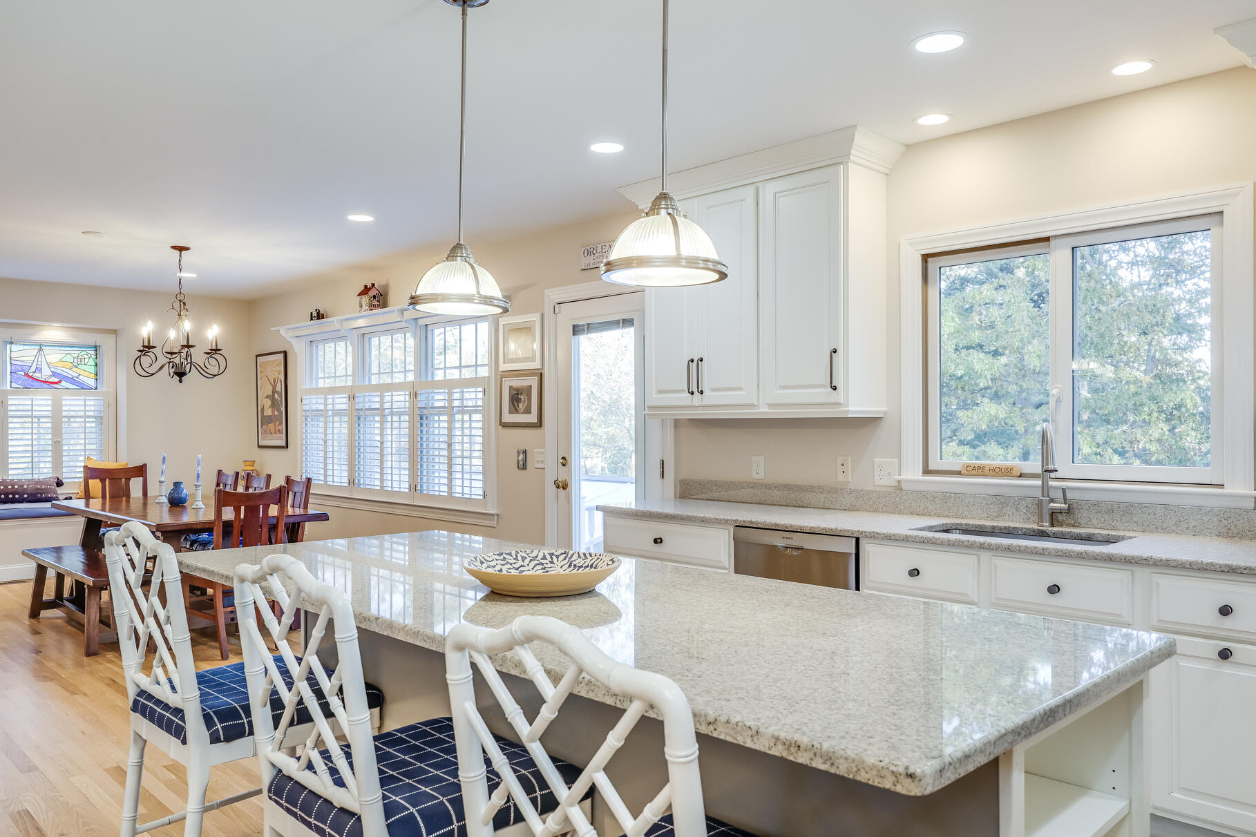 9 Ridgewood Road Orleans, MA 02653 - Photo 29 of 81 a kitchen with stainless steel appliances granite countertop a stove a sink a refrigerator a dining table and chairs