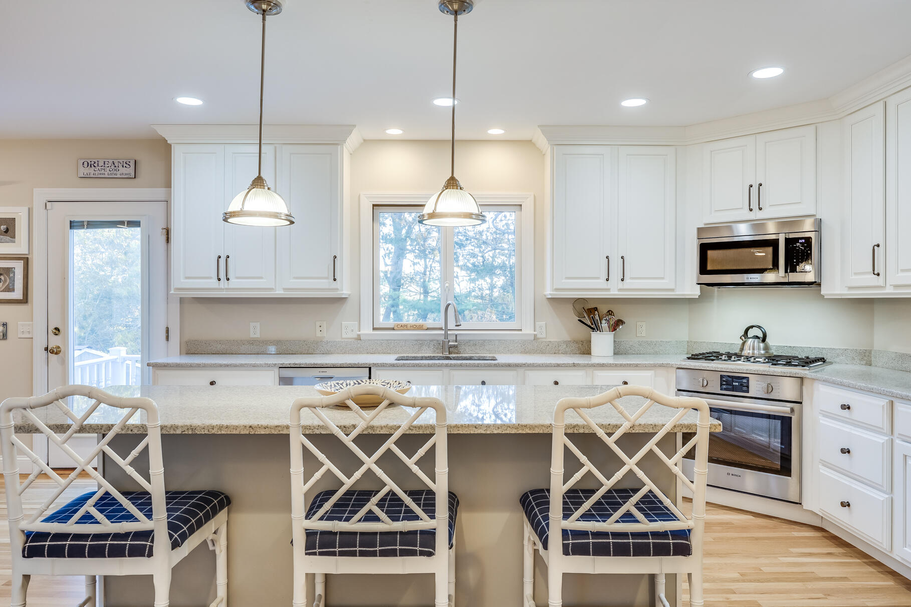 9 Ridgewood Road Orleans, MA 02653 - Photo 30 of 81 a kitchen that has a lot of cabinets in it and wooden floors