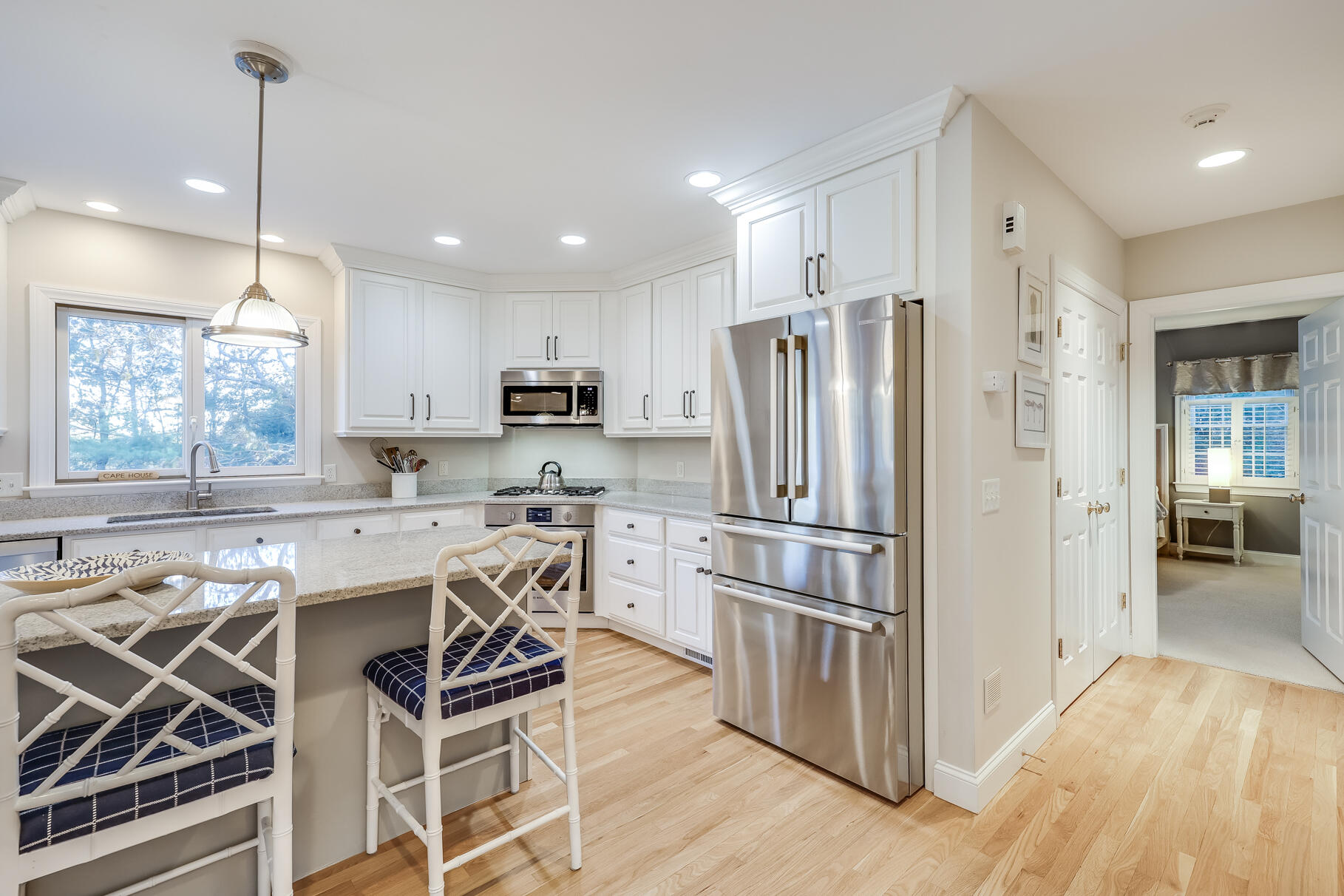 9 Ridgewood Road Orleans, MA 02653 - Photo 31 of 81 a kitchen with a refrigerator a sink and wooden floor