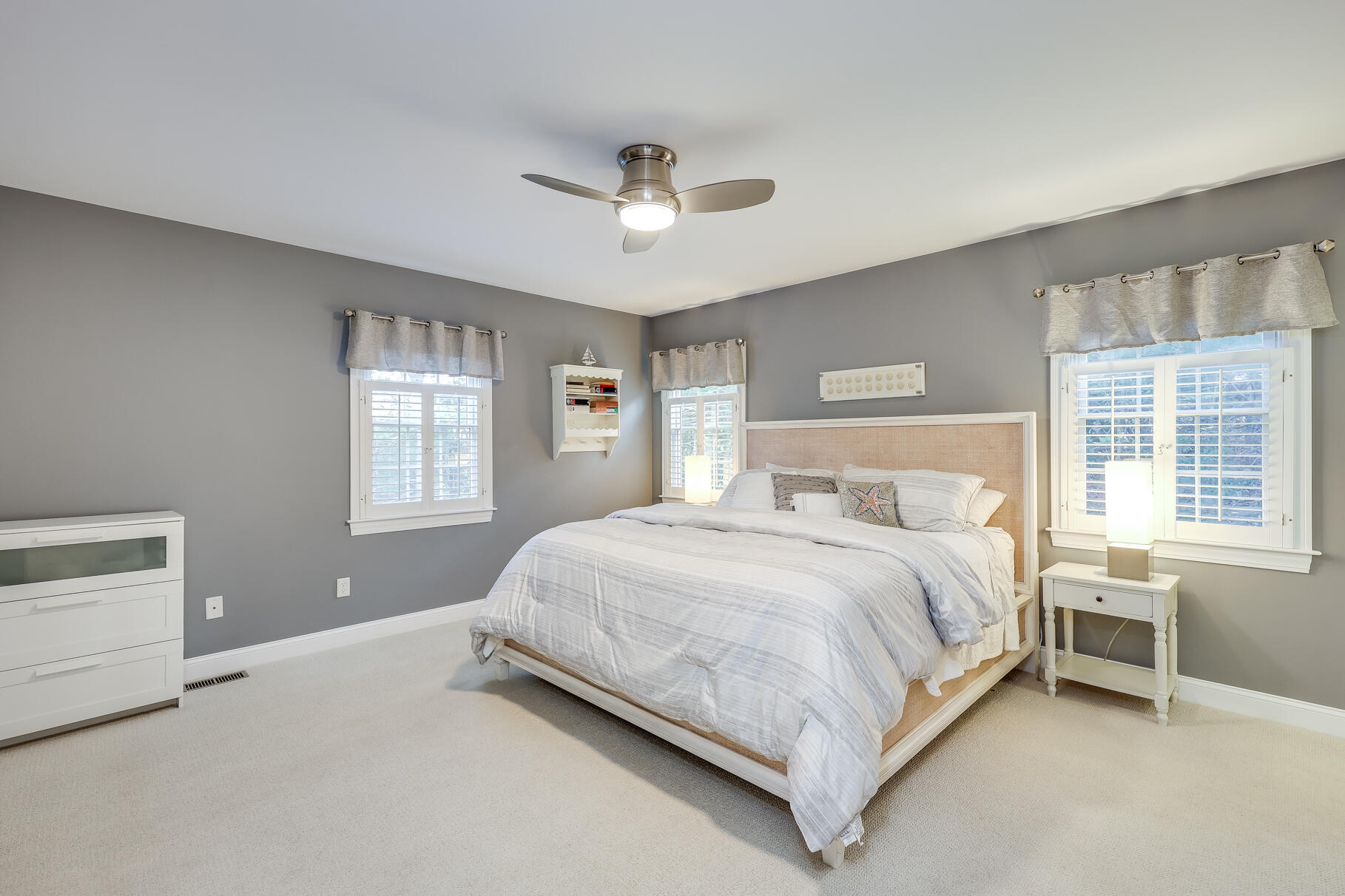 9 Ridgewood Road Orleans, MA 02653 - Photo 32 of 81 a bed sitting in a bedroom next to a window and a lamp