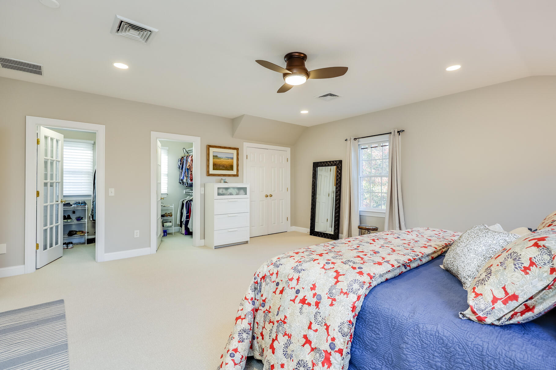 9 Ridgewood Road Orleans, MA 02653 - Photo 46 of 81 a bedroom with a bed and a chandelier