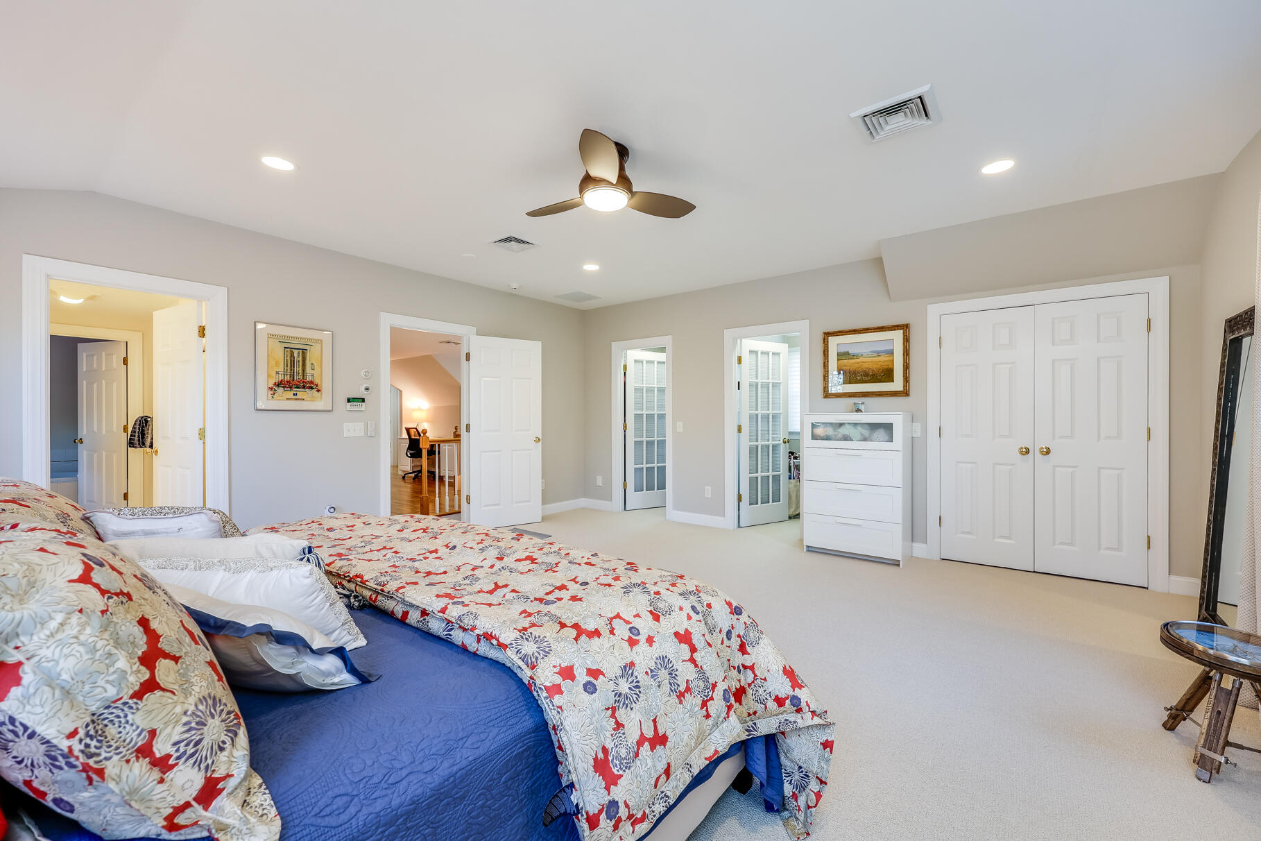 9 Ridgewood Road Orleans, MA 02653 - Photo 48 of 81 a bedroom with a bed and a chandelier