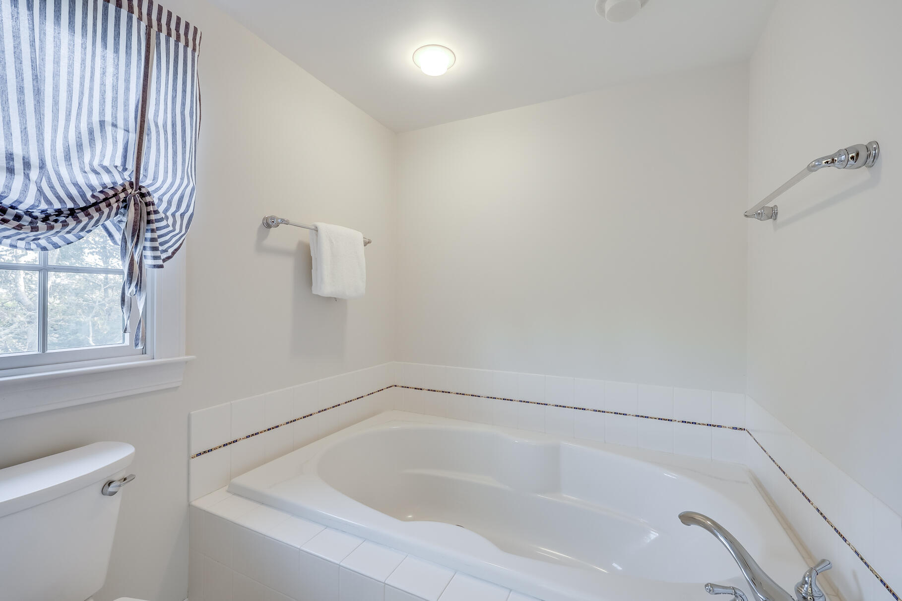 9 Ridgewood Road Orleans, MA 02653 - Photo 52 of 81 a white bath tub sitting next to a white sink and vanity