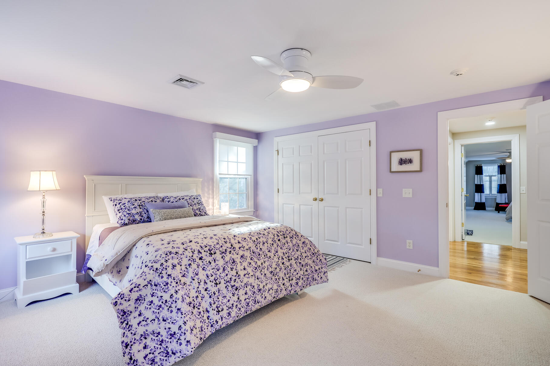 9 Ridgewood Road Orleans, MA 02653 - Photo 59 of 81 a bedroom with a large bed and chandelier