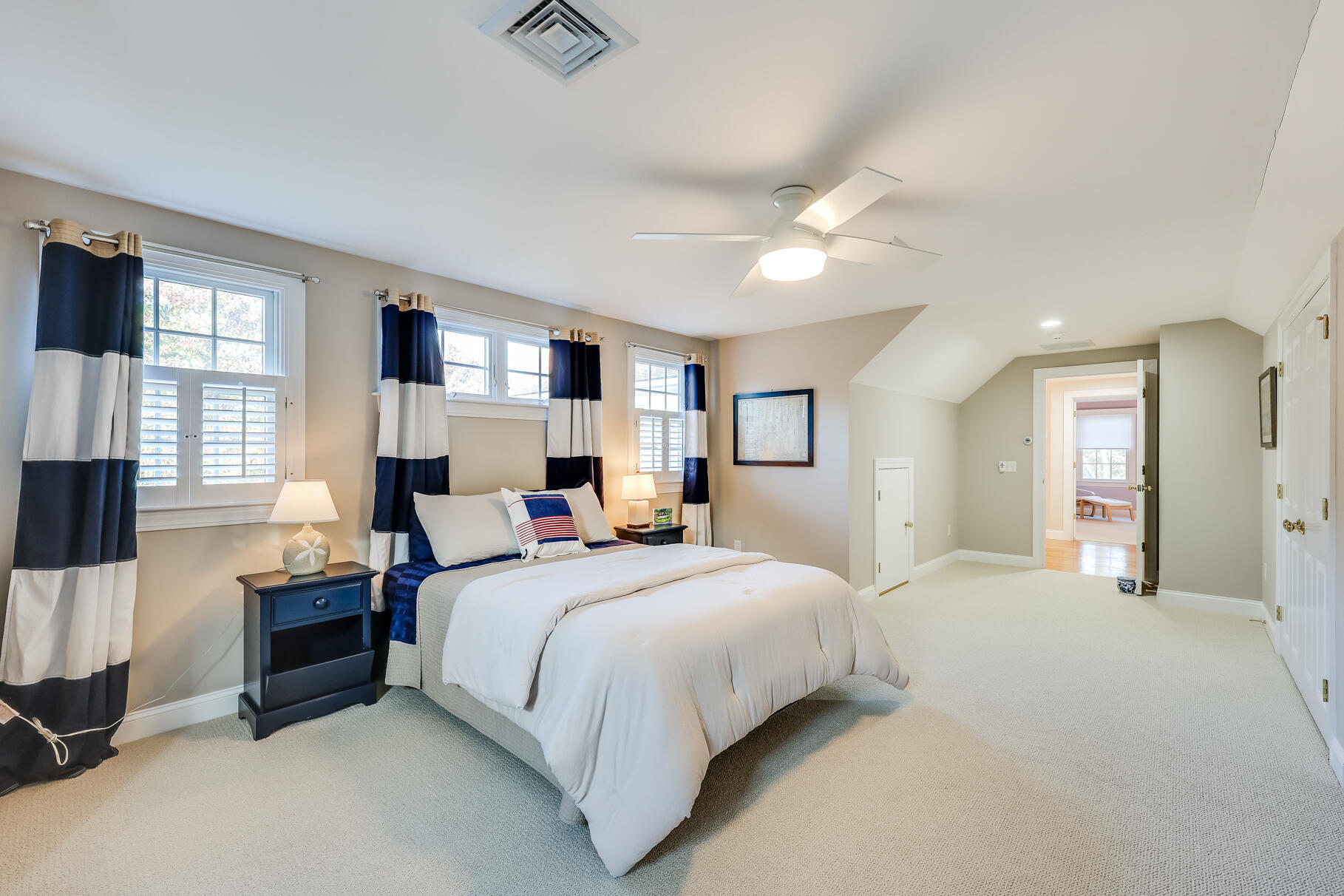 9 Ridgewood Road Orleans, MA 02653 - Photo 67 of 81 a bedroom with a large bed and a chandelier