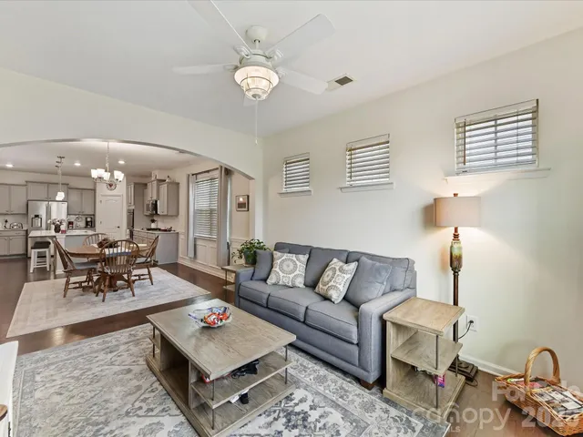 a living room with furniture and a table
