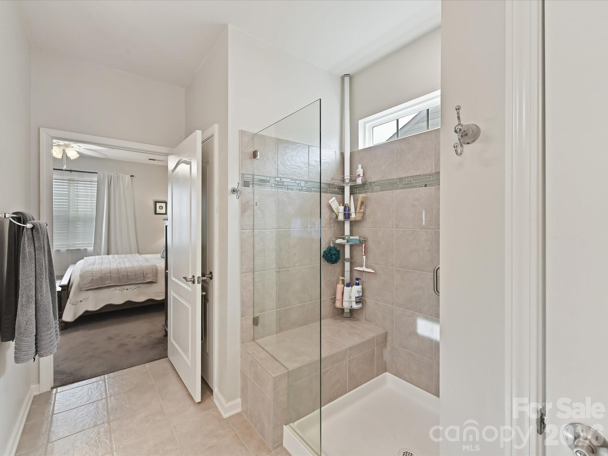 3302 Oliver Stanley Trail Lancaster, SC 29720 - Photo 19 of 48 a bathroom with a tub shower and a sink