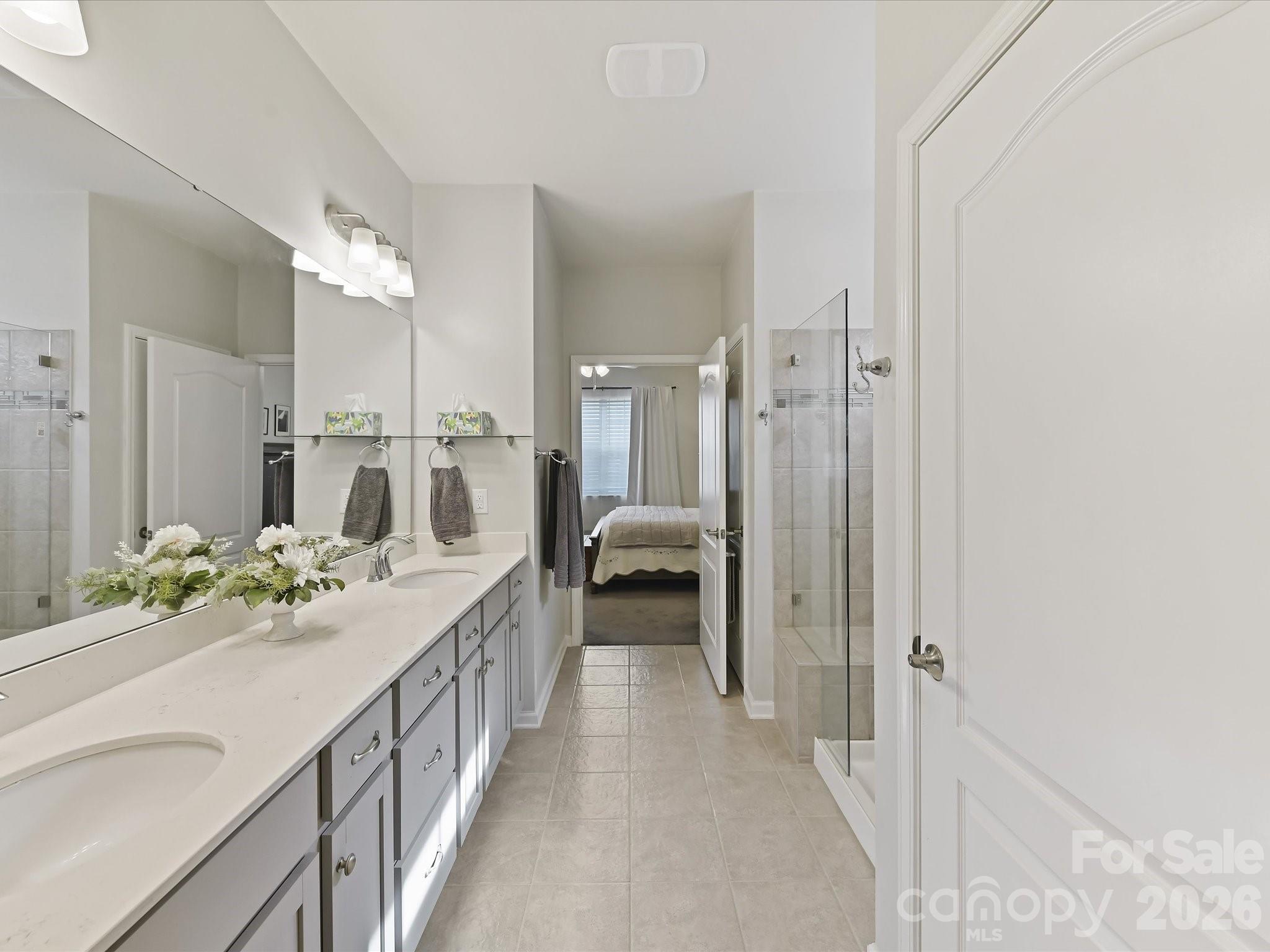 3302 Oliver Stanley Trail Lancaster, SC 29720 - Photo 20 of 48 a en suite bathroom with a double vanity sink and a mirror