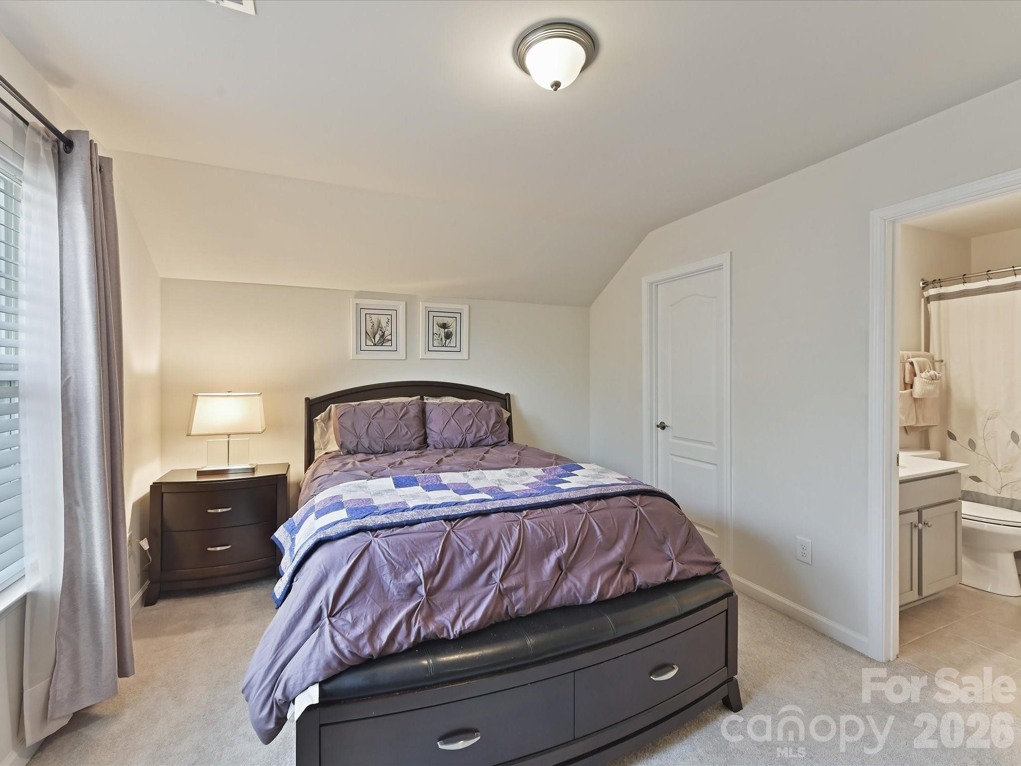 3302 Oliver Stanley Trail Lancaster, SC 29720 - Photo 26 of 48 a bedroom with a bed and a view of bathroom