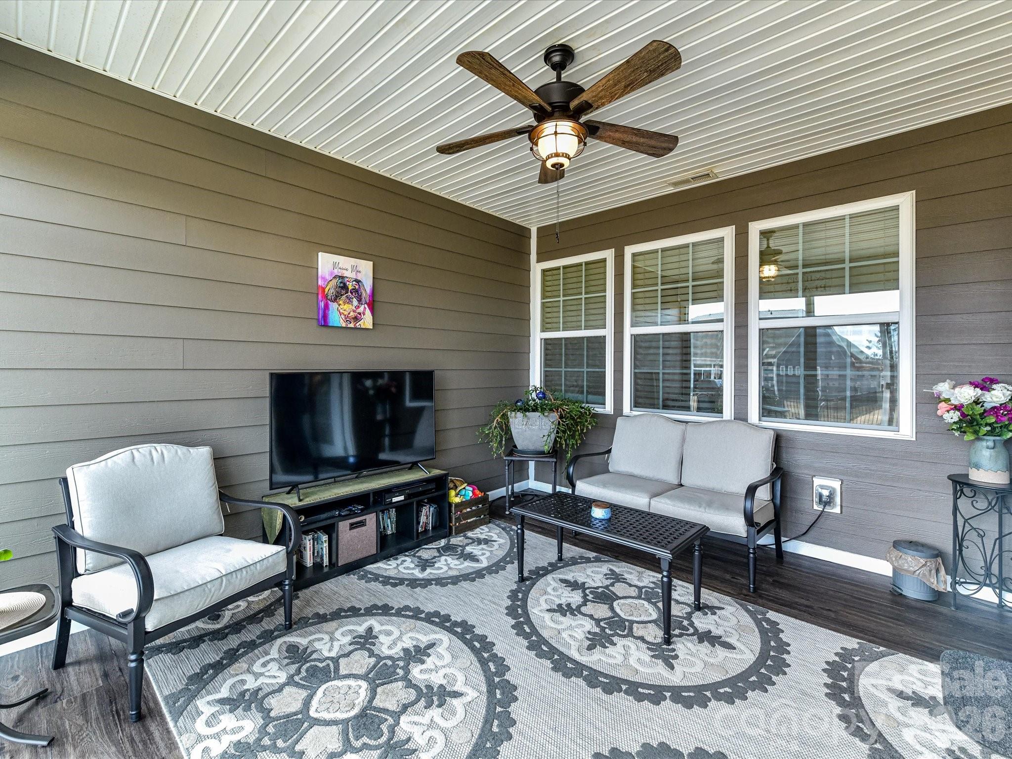 3302 Oliver Stanley Trail Lancaster, SC 29720 - Photo 31 of 48 a living room with furniture a flat screen tv and a large window