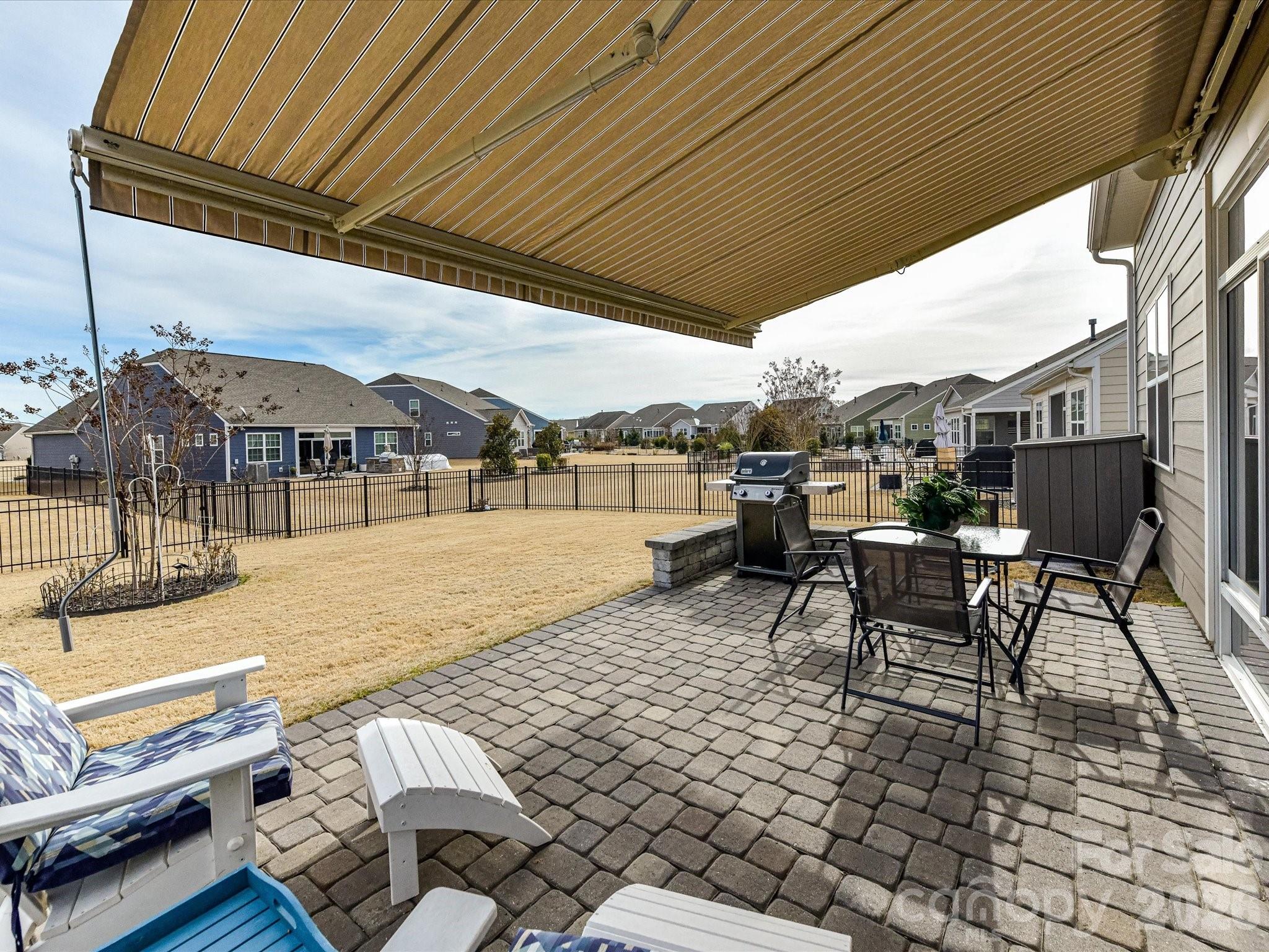 3302 Oliver Stanley Trail Lancaster, SC 29720 - Photo 33 of 48 a roof deck with table and chairs and potted plants