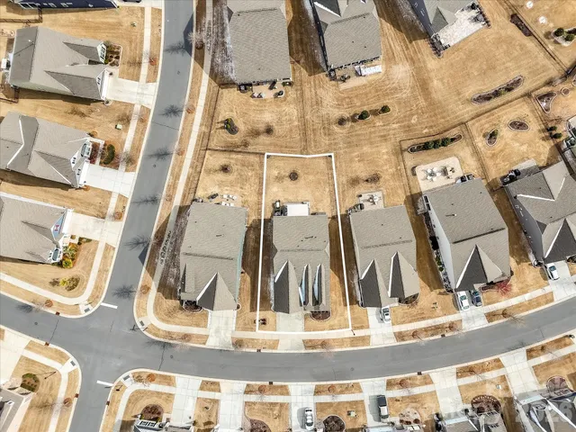 an aerial view of a house with swimming pool