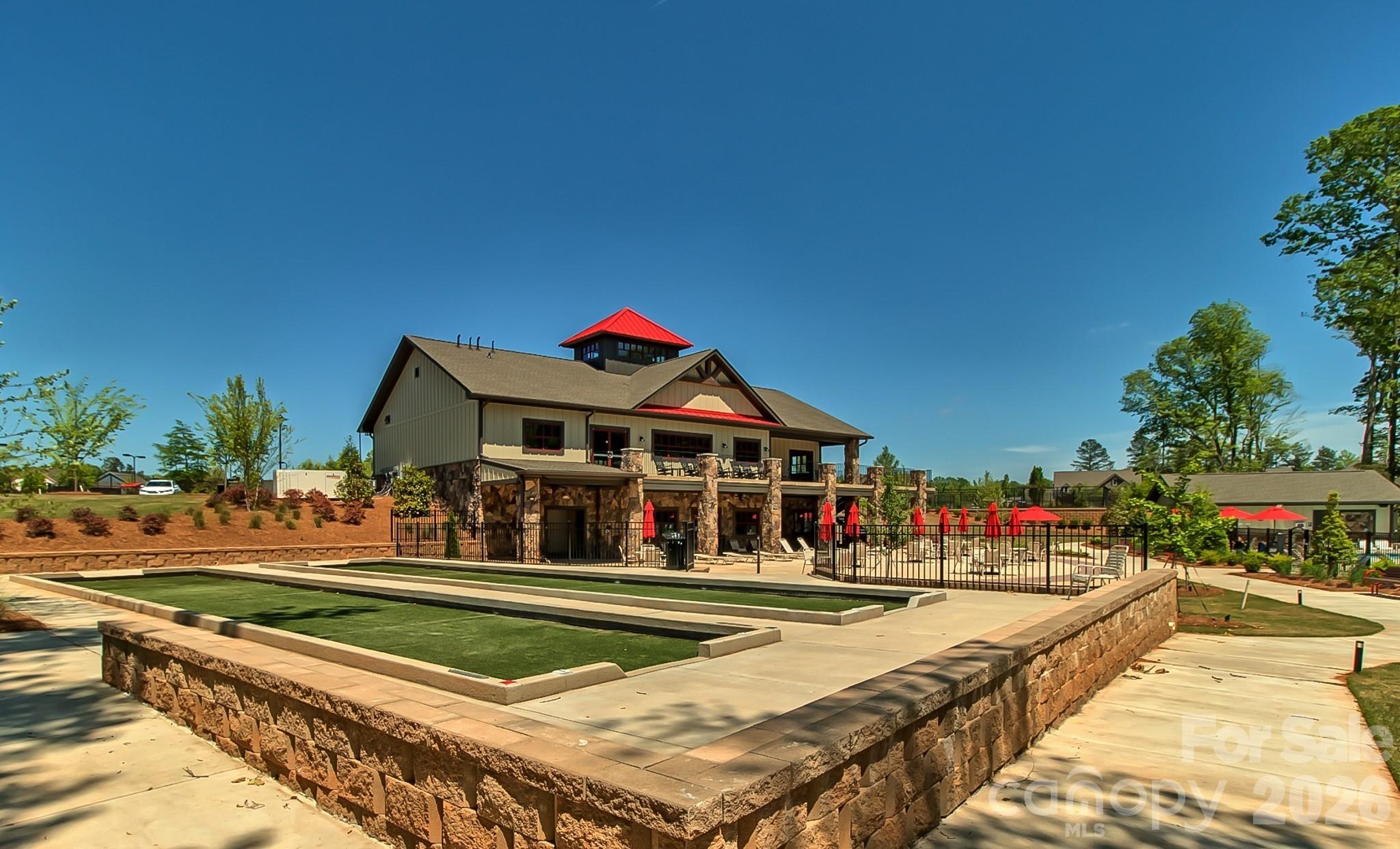 3302 Oliver Stanley Trail Lancaster, SC 29720 - Photo 42 of 48 a view of swimming pool with outdoor seating and trees in the background