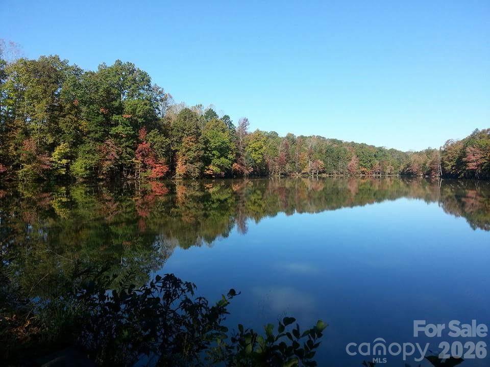 3302 Oliver Stanley Trail Lancaster, SC 29720 - Photo 45 of 48 a view of a lake with houses in background