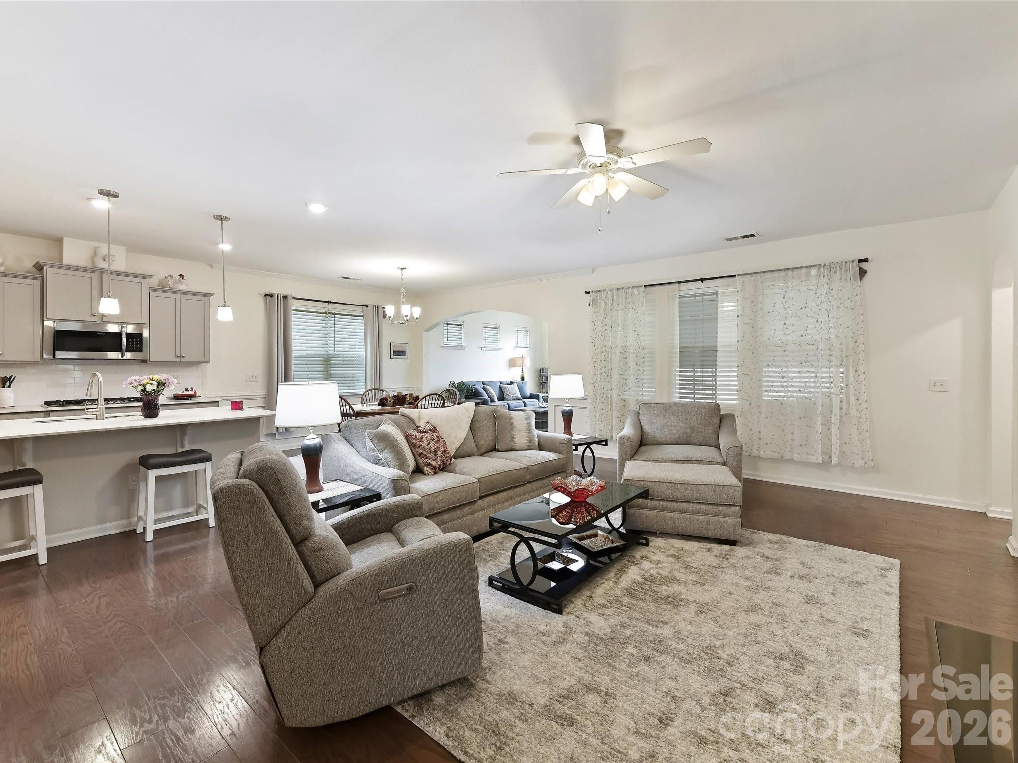 3302 Oliver Stanley Trail Lancaster, SC 29720 - Photo 7 of 48 a living room with furniture kitchen view and a chandelier