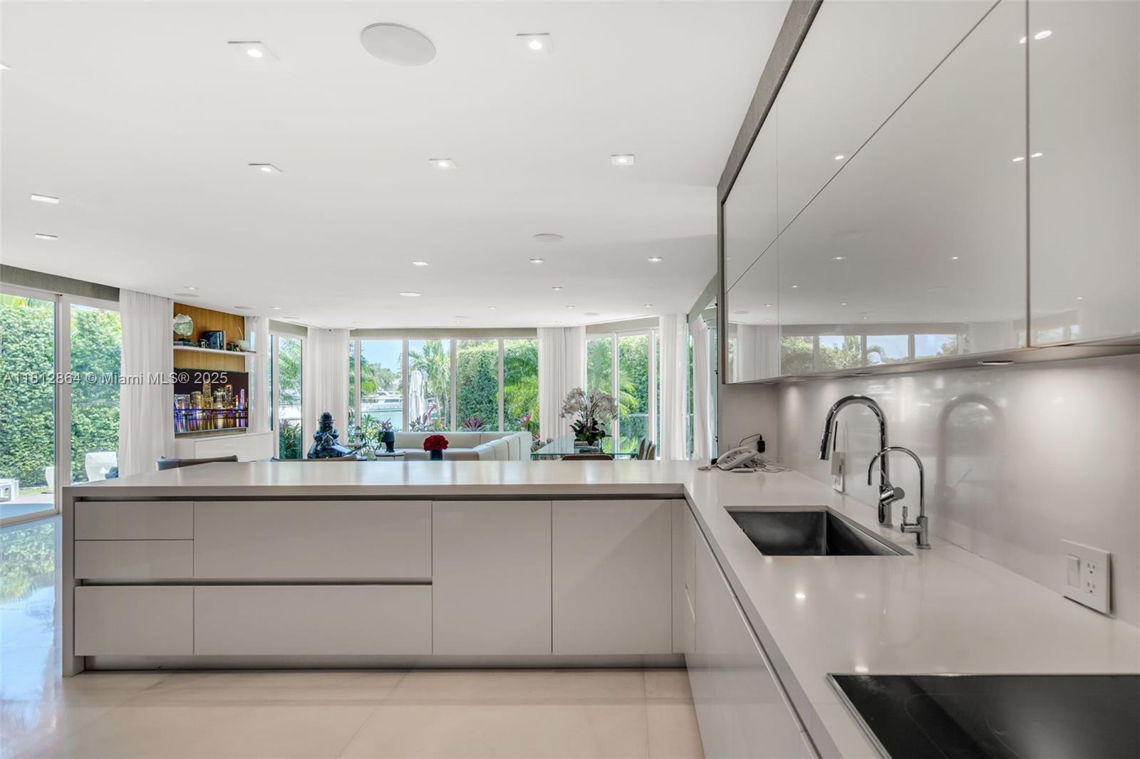 420 Island Drive Key Biscayne, FL 33149 - Photo 17 of 84 a kitchen with kitchen island a large window in it