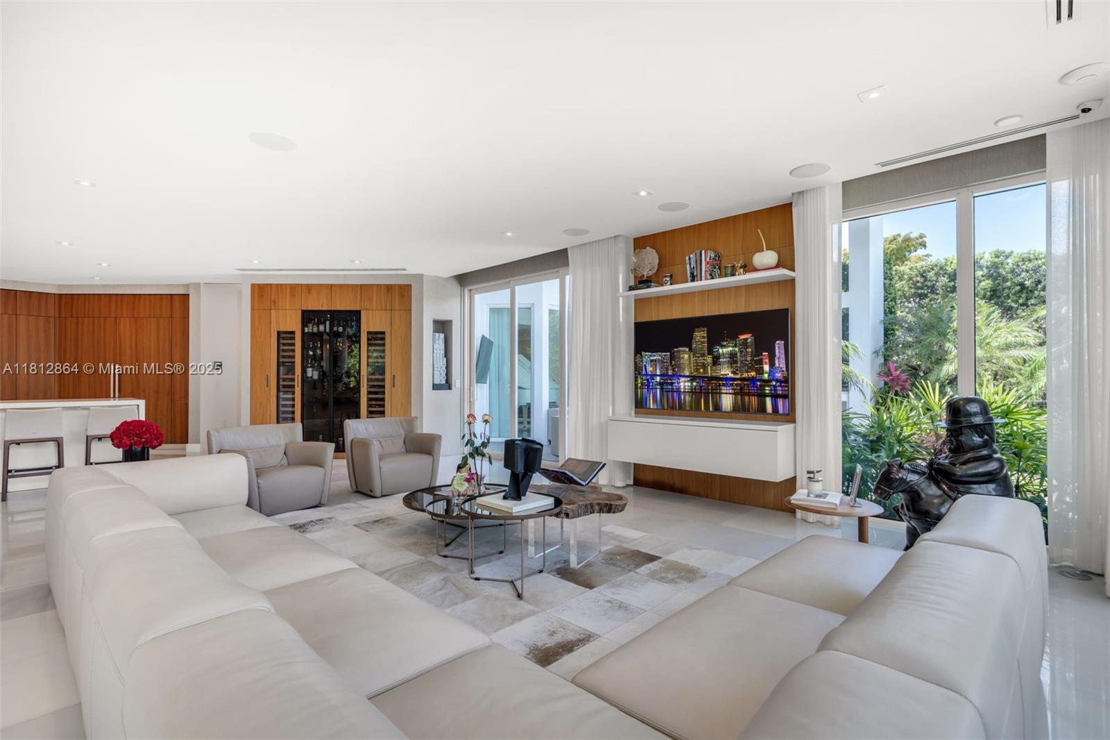 420 Island Drive Key Biscayne, FL 33149 - Photo 21 of 84 a living room with furniture potted plant floor to ceiling window and potted plant