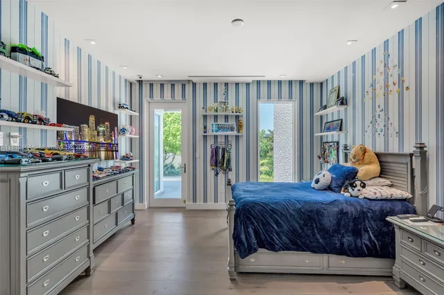an aerial view of a house with swimming pool garden view and a mountain view