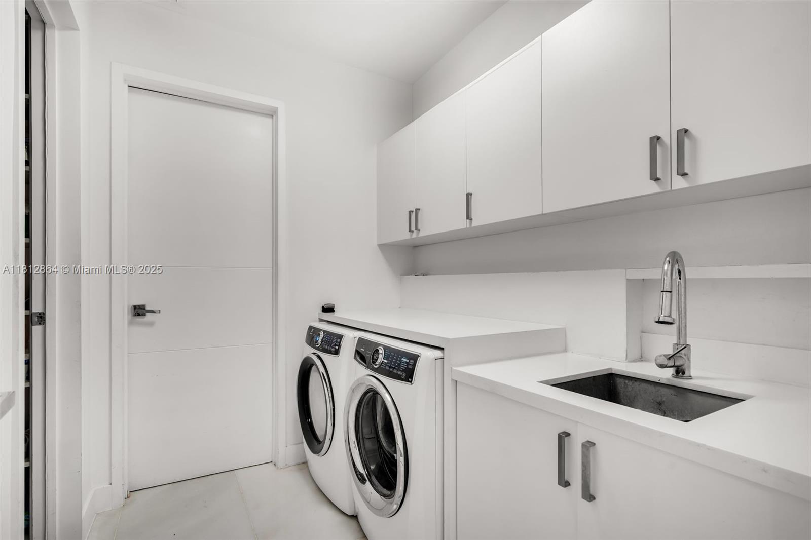 420 Island Drive Key Biscayne, FL 33149 - Photo 46 of 84 a utility room with dryer and washer