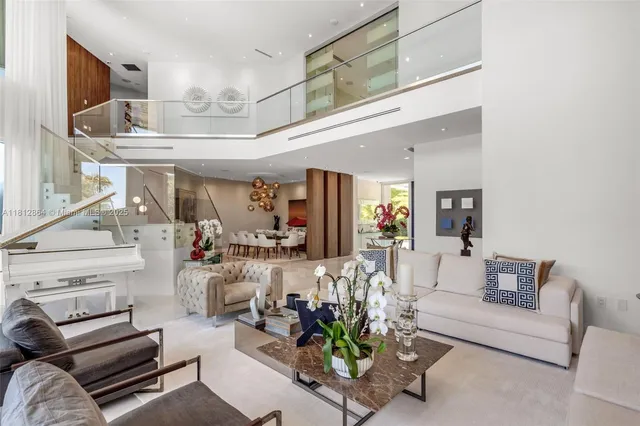 a kitchen with kitchen island a large window in it