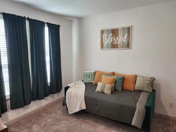 a bedroom with a bed and a furniture