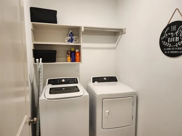 a kitchen with sink stove and refrigerator