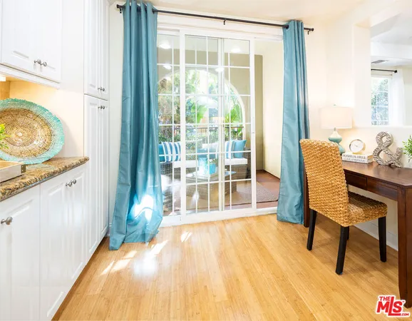 a room with wooden floor and furniture