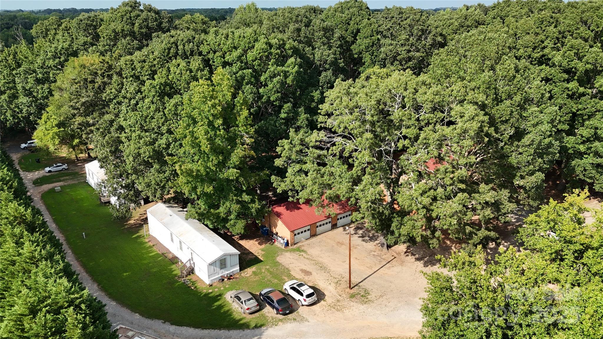 115 Nathaniel Lane Kannapolis, NC 28081 - Photo 11 of 19 an aerial view of a house with a yard and large trees