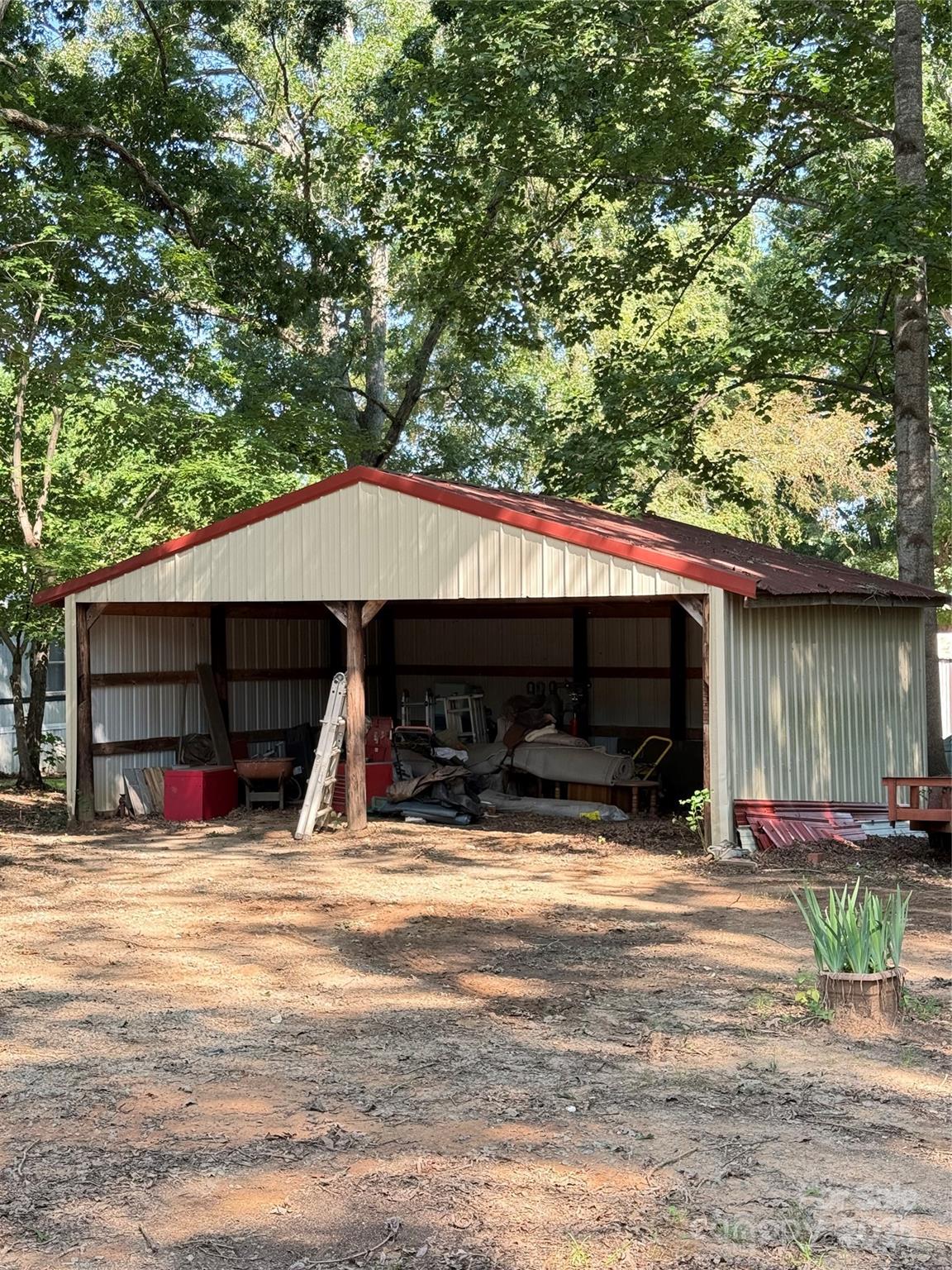 115 Nathaniel Lane Kannapolis, NC 28081 - Photo 16 of 19 a view of a house with two chairs in a patio
