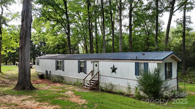 a aerial view of a house with a yard