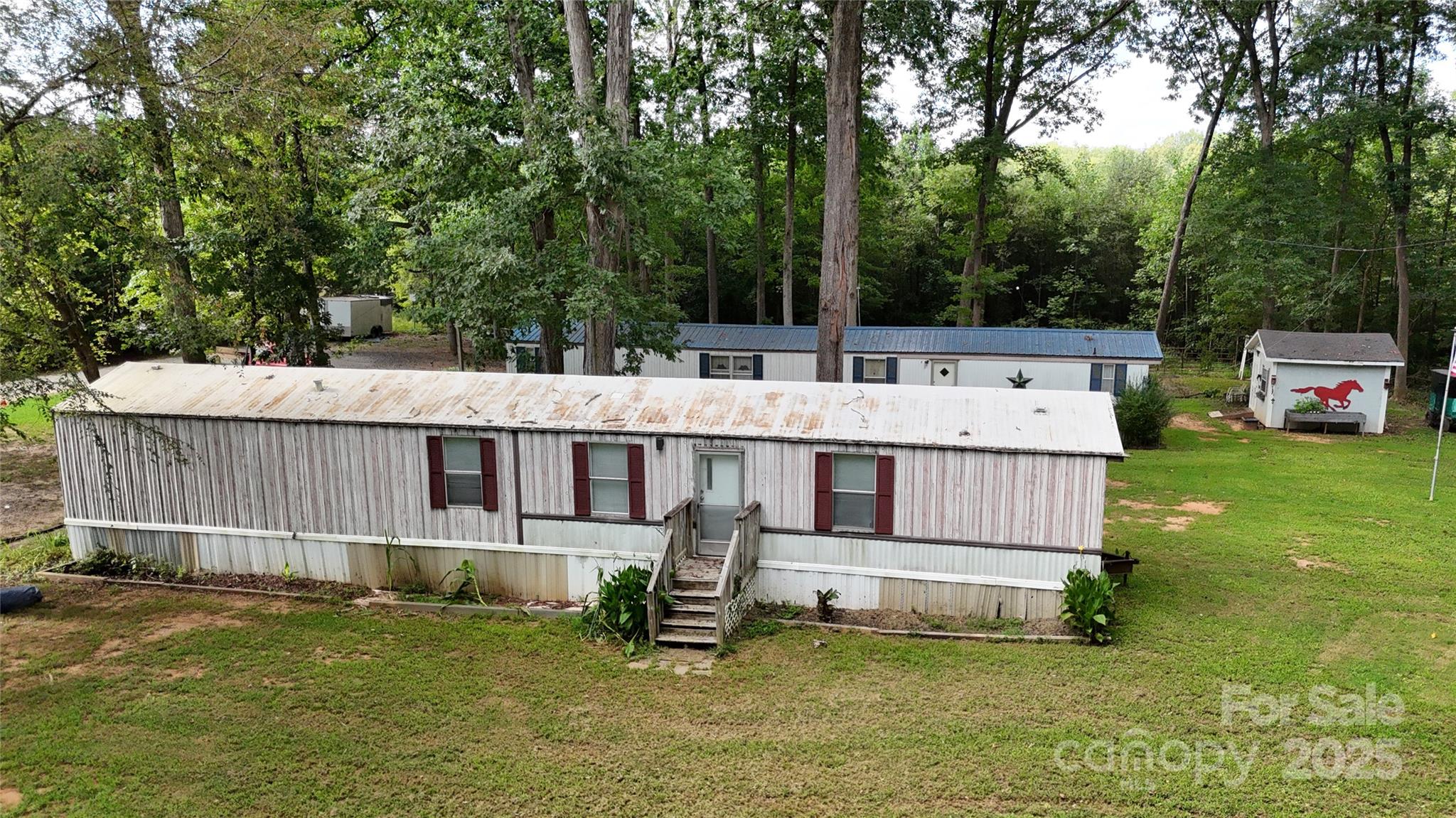115 Nathaniel Lane Kannapolis, NC 28081 - Photo 8 of 19 a aerial view of a house with swimming pool next to a big yard