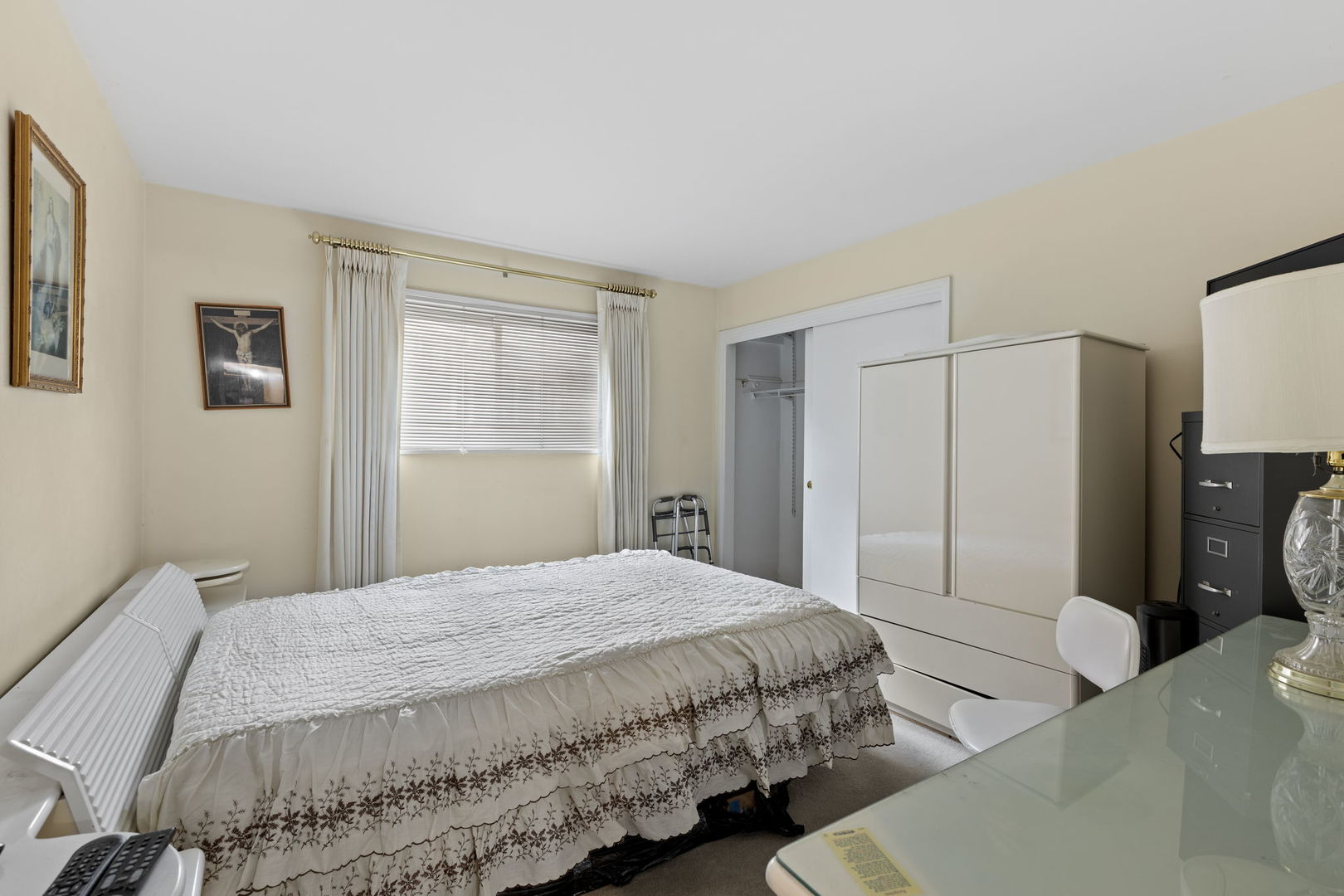 7227 North Ridge Boulevard, Unit 1A Chicago, IL 60645 - Photo 13 of 14 a bedroom with a bed a dresser and a window