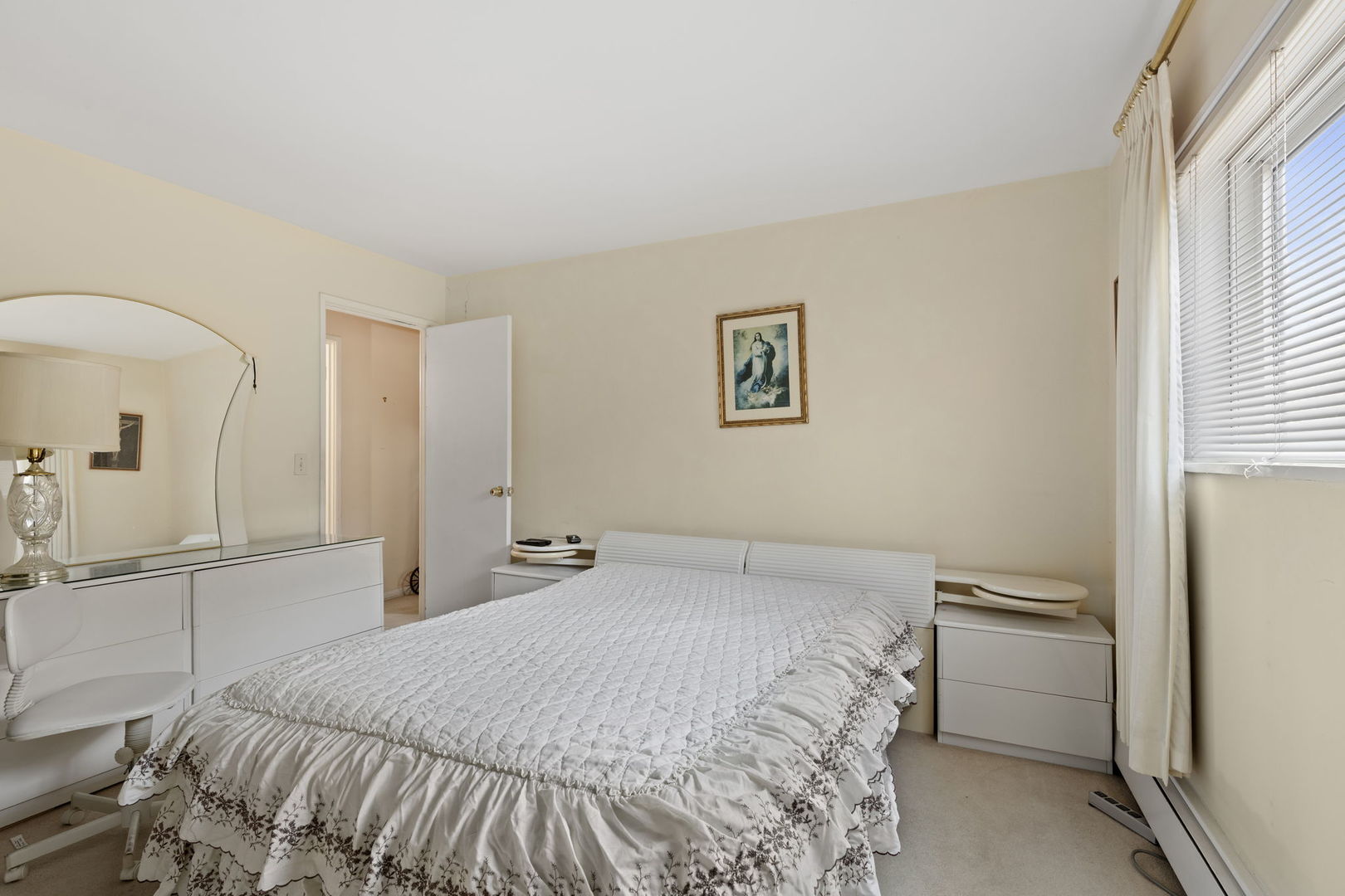 7227 North Ridge Boulevard, Unit 1A Chicago, IL 60645 - Photo 14 of 14 a bedroom with a bed and a cabinets