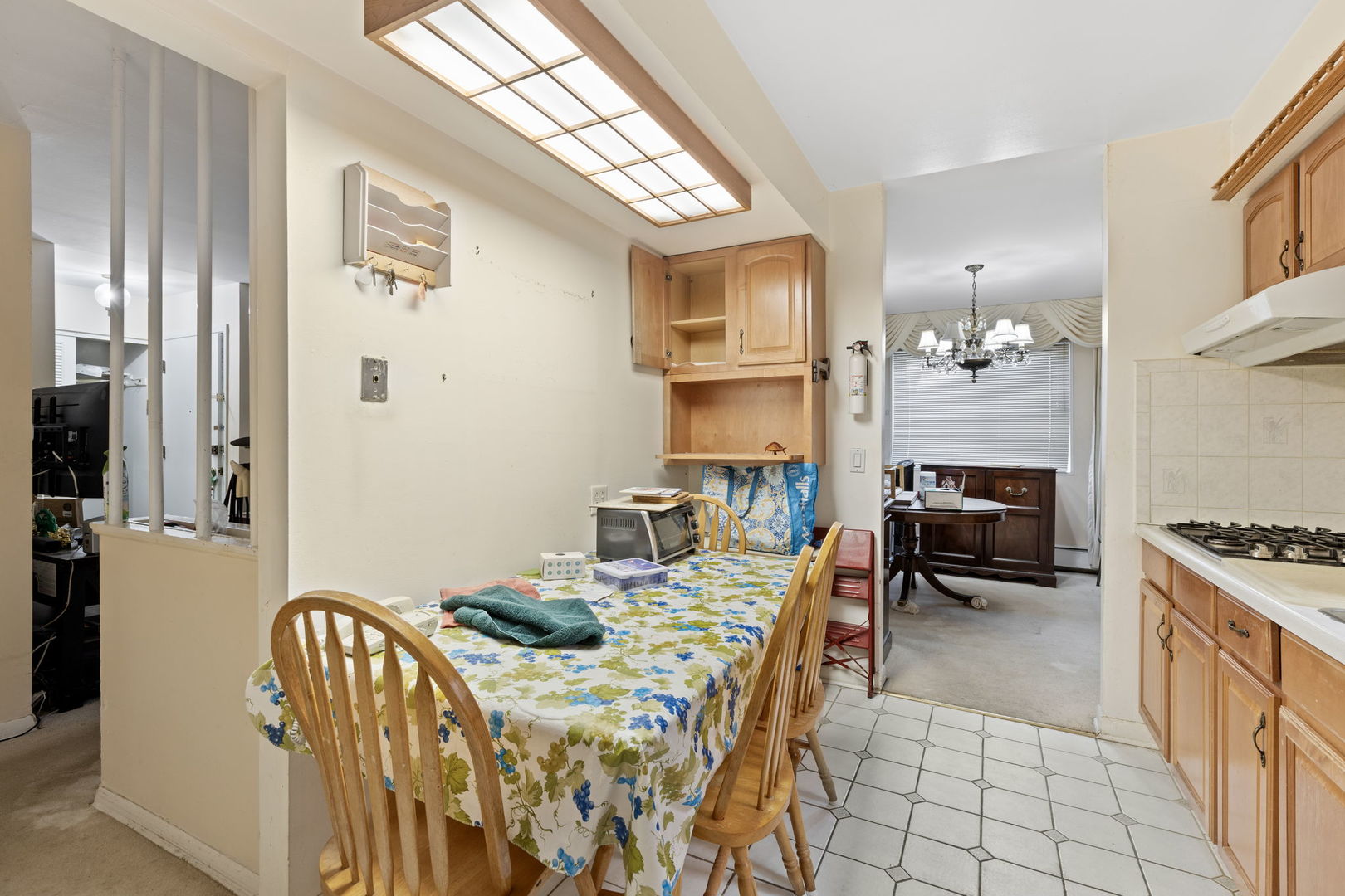 7227 North Ridge Boulevard, Unit 1A Chicago, IL 60645 - Photo 4 of 14 a dining room with furniture and wooden floor