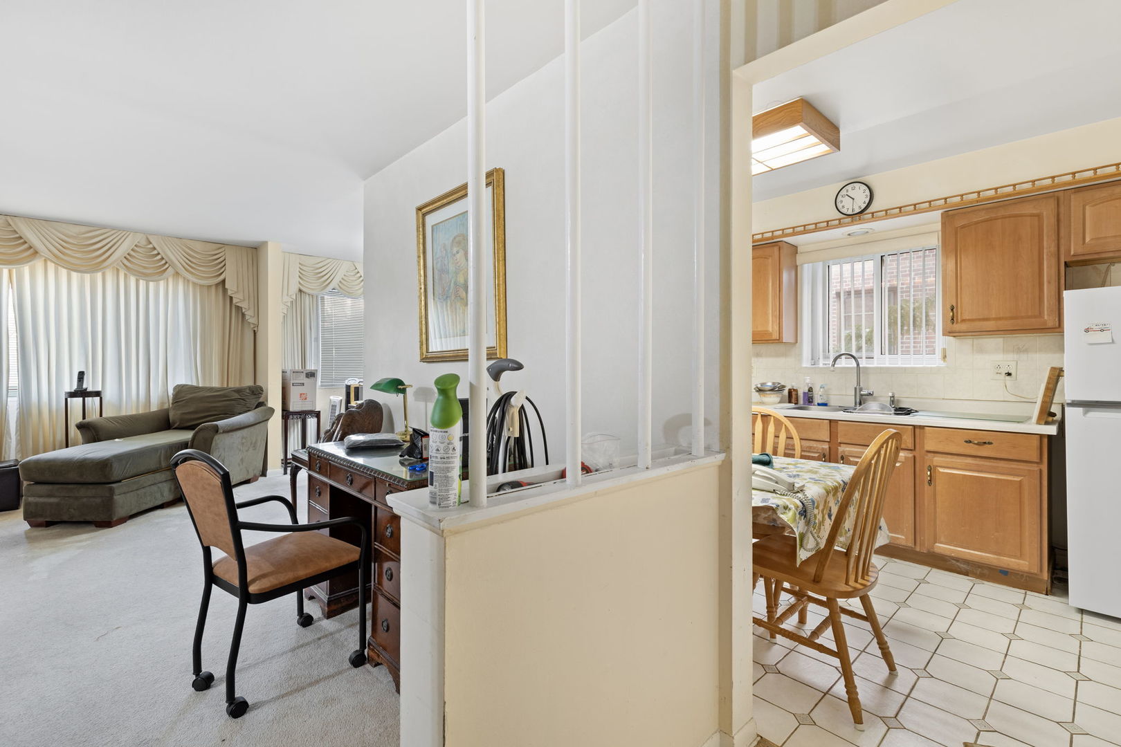 7227 North Ridge Boulevard, Unit 1A Chicago, IL 60645 - Photo 5 of 14 a dining room with furniture and a large window