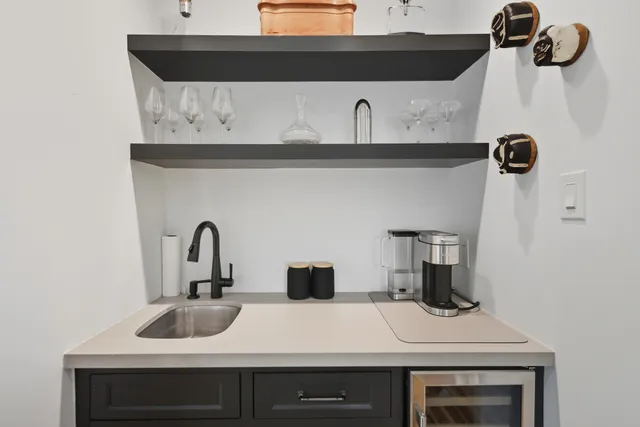 a living room with fireplace furniture and a flat screen tv