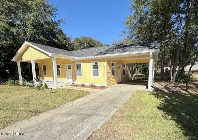 front view of a house with a garden