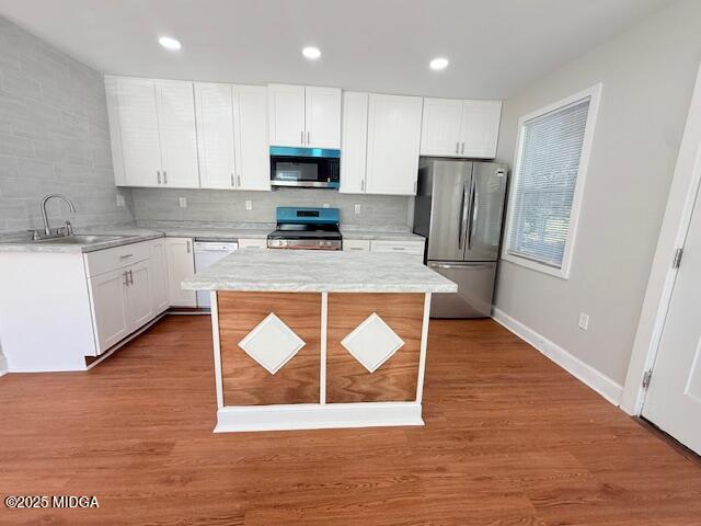 3723 Spencer Circle Macon, GA 31206 - Photo 4 of 18 a kitchen with wooden floors and wooden cabinets