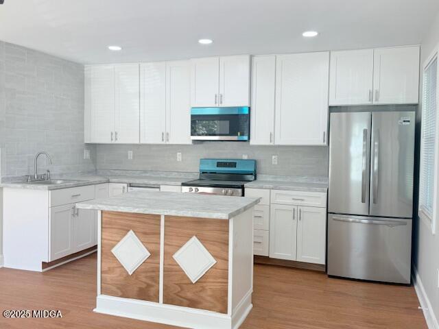 3723 Spencer Circle Macon, GA 31206 - Photo 5 of 18 a kitchen with a refrigerator stove top oven and cabinets