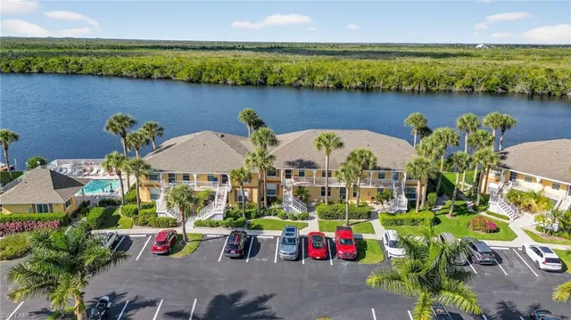 an outdoor space with furniture and water view