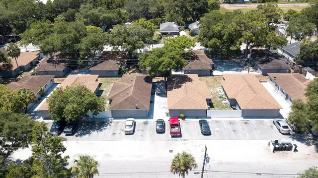 an aerial view of residential houses with outdoor space