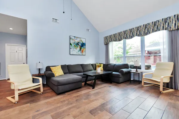 a living room with furniture and a large window