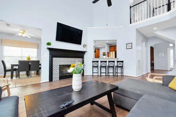 a dining room with furniture and wooden floor