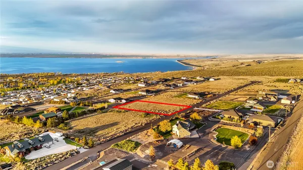 an aerial view of residential building and ocean
