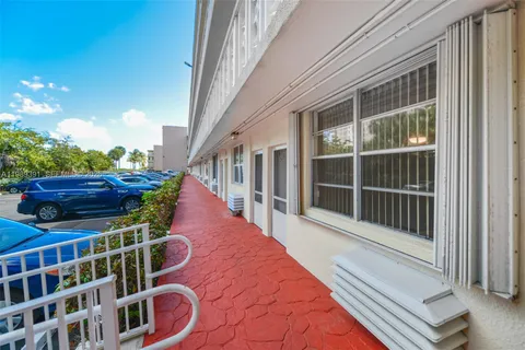 a view of a balcony with chairs