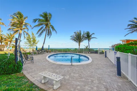 a view of outdoor space with palm trees