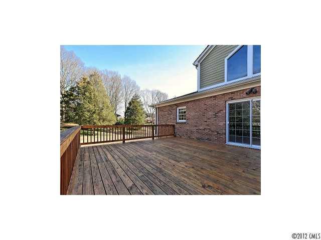 4443 Carmel Road Charlotte, NC 28226 - Photo 14 of 16 a view of balcony with wooden floor and fence