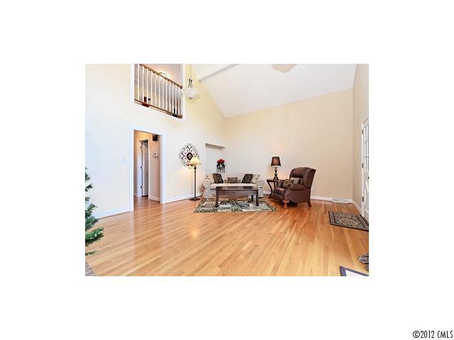 4443 Carmel Road Charlotte, NC 28226 - Photo 4 of 16 a living room with furniture and a wooden floor